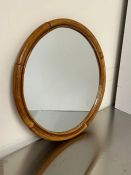 A small cane circular mirror