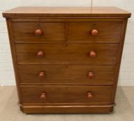A mahogany two over three chest of drawers