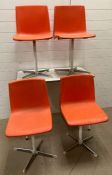 A Formica kitchen table with four Mid Century Steelux London orange chairs (H74cm W92cm D60cm)