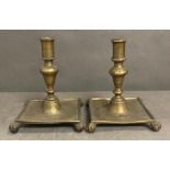 A pair of brass Victorian, Queen Anne style candle sticks