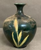 In the style of Moorcroft Apprentice bottle vase, signed to base