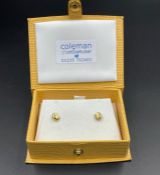 A Pair of 9ct gold earrings, boxed.