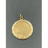 A 9ct gold pendant with Scorpio emblem to front (Approximate weight 4g)