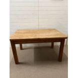 A pine refectory dining table with drawers to end (H75cm W137cm D93cm)