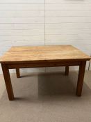 A pine refectory dining table with drawers to end (H75cm W137cm D93cm)