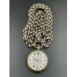 An enamel faced ladies silver pocket watch on a sterling silver chain.