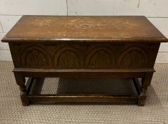 An oak carved chest of small portions on turned legs(H91cm W67cm D37cm)