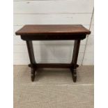 An oak side table with peg sides (H64cm W65cm D28cm)