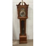 An Emperor longcase clock with acorn and eagle finials.