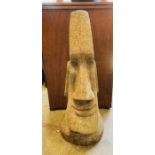 A garden stone Easter Island head