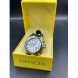 Invicta quartz chronograph gold dial gold blue bezel gold ip case ss case black silicon strap.