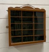 A wall hanging display case