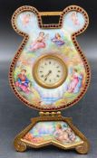 A hand painted porcelain French easel clock with a classical scene