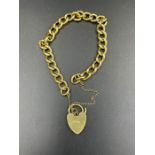 An 18ct gold bracelet with a heart shaped fastener and safety chain (Approximate Total Weight 35g)