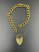 An 18ct gold bracelet with a heart shaped fastener and safety chain (Approximate Total Weight 35g)