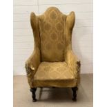 In the style of a Charles II upholstered wing chair