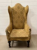 In the style of a Charles II upholstered wing chair