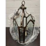 A Christopher Hyde gothic lantern, solid brass with bevelled glass finished in dark bronze (H64cm)