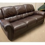 A Violino three seater brown leather sofa (H97cm W207cm D105cm)