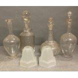 Four glass decanters and two glass lampshades