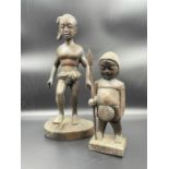 Two wooden carved figures.