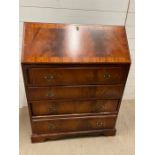 A mahogany bureau with fitted interior of pigeon holes and small drawers on bracket feet (H100cm