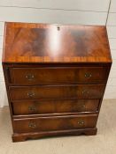 A mahogany bureau with fitted interior of pigeon holes and small drawers on bracket feet (H100cm
