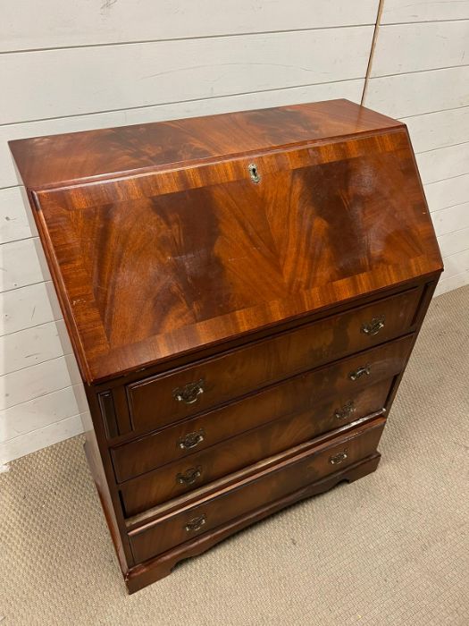 A mahogany bureau with fitted interior of pigeon holes and small drawers on bracket feet (H100cm - Image 2 of 5