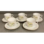 A set of five Rostrand coffee cups and saucers