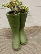 A garden planter in the form of Wellington boots