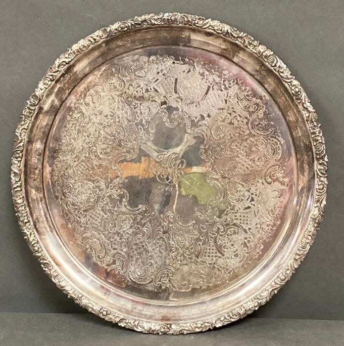 A silver plated tray dated for 1948, 36 cm in diameter