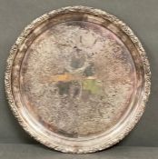 A silver plated tray dated for 1948, 36 cm in diameter