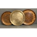 Three trays, one brass and two wooden
