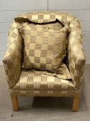 A tub chair with checked upholstery
