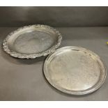Two silver plated platters, one with feet