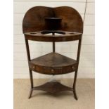 A mahogany comer wash stand