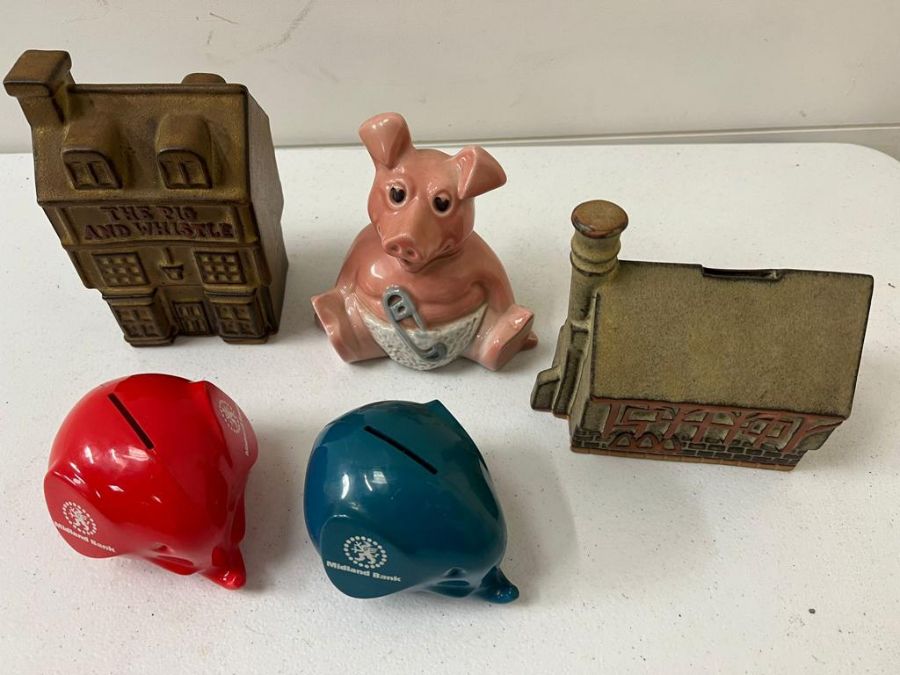 Five novelty money boxes including NatWest pig and Midland bank