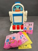 A talking tutor robot by Tomy time toys
