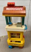 A McDonalds vintage play cart with till and serving hatch