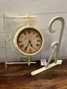 A reproduction wall clock with wall hanging
