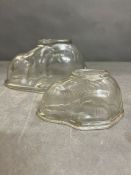 Two glass jelly moulds in the shape of rabbits