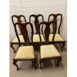 Five mahogany dining chairs