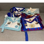 A selection of Masons Aprons, medals and sashes