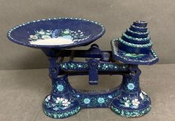 A set of blue painted scales with weights.