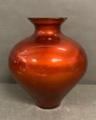 A large orange vase