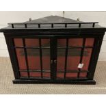 An ebonised corner hanging unit with glazed front (W62cm D30cm)