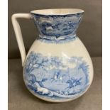 A blue transfer printer pitcher showing a round up of wild horses