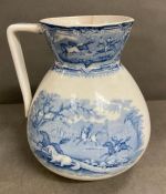 A blue transfer printer pitcher showing a round up of wild horses