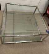 A Libra stainless steel and glass architecturally inspired coffee table (H40cm Sq100cm)