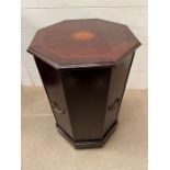 A side table of octagonal shape opening to a shelf (H72cm W46cm)